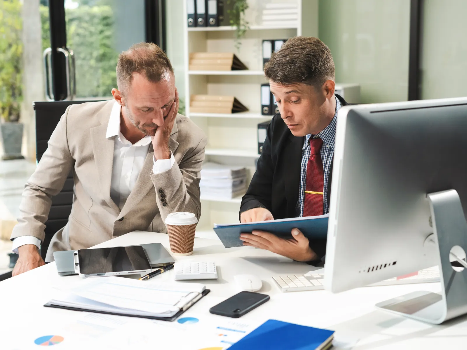 men looking at a computer screen