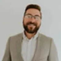 a man with a beard and glasses